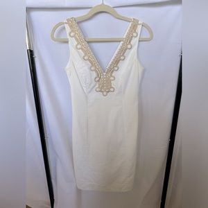 White dress with gold trim